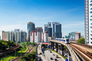 Fototapeta na wymiar A KL Monorail skytrain running above the traffic, Kuala Lumpur, Malaysia
