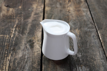 Coffee milk on a wooden background. Coffee additive