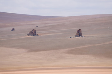 Fototapeta na wymiar Rock formations in the highlands of Bolivia. Landscape of the Bolivian highlands. Desert landscape of the Andean plateau of Bolivia