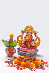 Indian Festival Diwali , Laxmi Pooja with Copper Kalash, coconut flower rangoli on white background