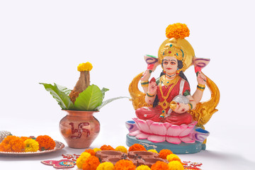 Indian Festival Diwali , Laxmi Pooja with Copper Kalash, coconut flower rangoli on white background