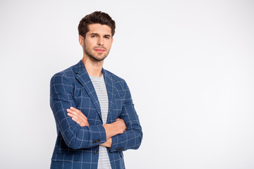 Turned photo of charming guy cross his hands wear checkered blue blazer jacket isolated over white...