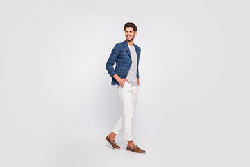 Full length profile side photo of pretty youth walk look wear blazer jacket pants trousers boat-shoes isolated over white background - Powered by Adobe