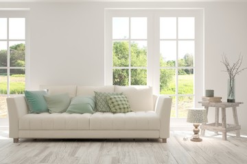 Stylish room in white color with sofa and summer landscape in window. Scandinavian interior design. 3D illustration
