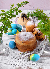 Obraz na płótnie Canvas Easter table setting; easter cakes, colored eggs and cottage cheese paskha