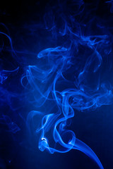 Blue smoke motion on black background.