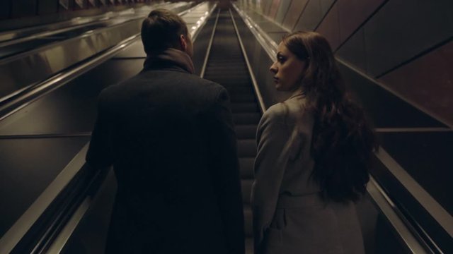 Young couple ascending on an elevator