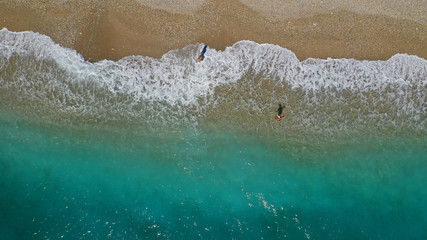Fototapeta na wymiar Aerial drone top down photo of tropical exotic sandy bay with emerald sea and waves