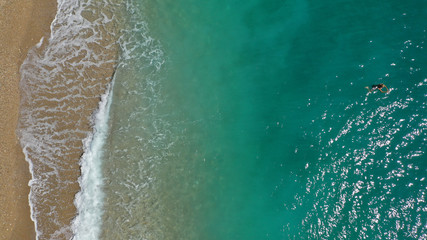 Aerial drone top down photo of tropical exotic sandy bay with emerald sea and waves