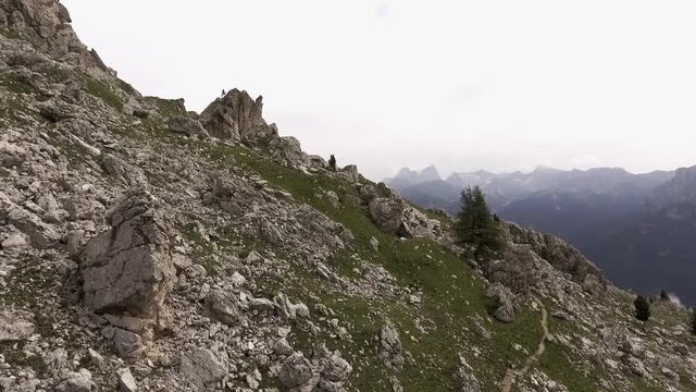 Dolomites Val di Fassa aerial shot, hiking trail "Vial de le Feide" or "Sentiero delle Pecore", beautiful excursion unesco