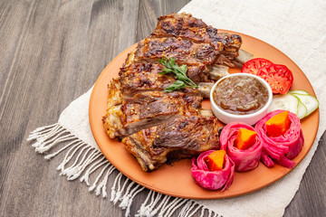 BBQ pork ribs with fermented, baked and fresh vegetables