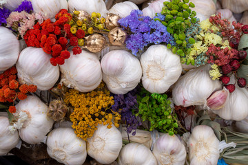 Autumn display with fresh garlic bulbs and flowers