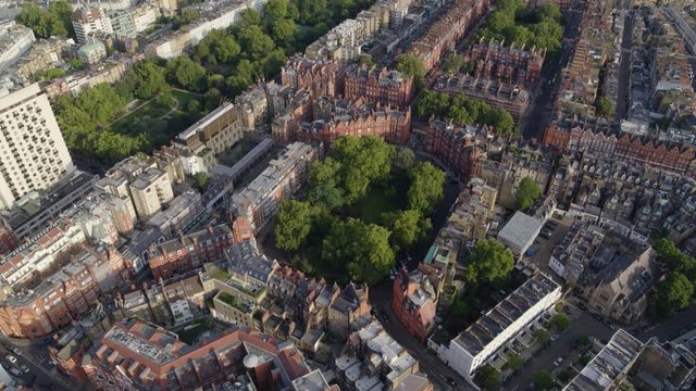 Aerial establishing shot of garden squares in Prime Central London, featuring the royal borough of South Kensington