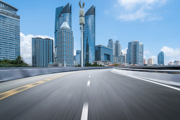 Fototapeta na wymiar empty highway with cityscape and skyline of qingdao,China.