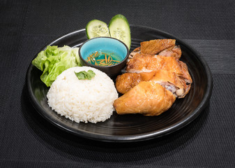 Roasted chicken with white rice and vegetables, served with fish sauce, vietnamese cuisine dish.