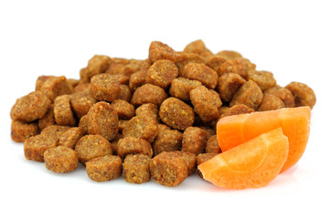 Dry food for dogs and cats with carrots.