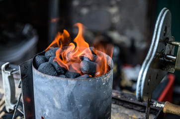BBQ Grill Pit Glowing And Flames Hot Charcoal Briquettes coal Food Background Or Texture Close-Up...
