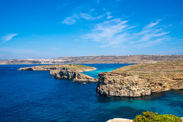 Stone cliffs on the blue lagoon of the island of Comino and Gozo Malta. Mediterranean Sea
