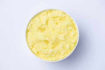 Yellow sugar scrub with the smell of lemon for the depilation process on a white background
