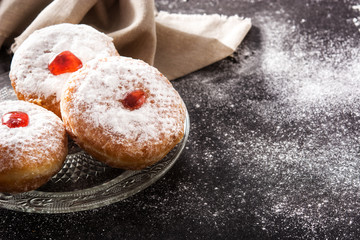 Hanukkah sufganiyot. Traditional Jewish donuts for Hanukkah. Copy space
