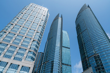 Obraz premium Looking Up Blue Modern Office Building