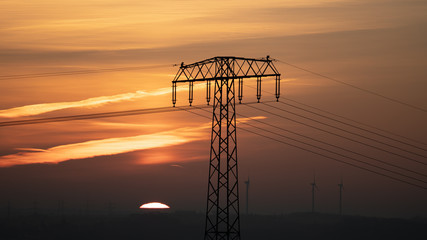 Power line and wind generator at early morning