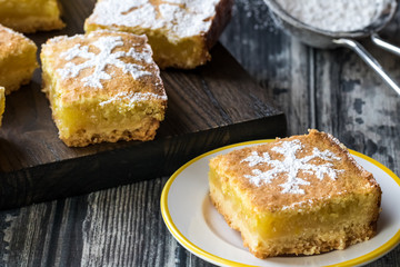 Lemon square with powdered sugar.