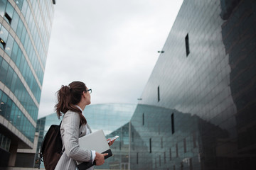 Graduate specialist comes to work in a large company. A young female Intern