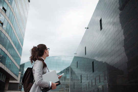 Graduate specialist comes to work in a large company. A young female Intern