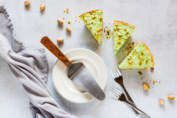 Pistachio cheesecakes flat lay.