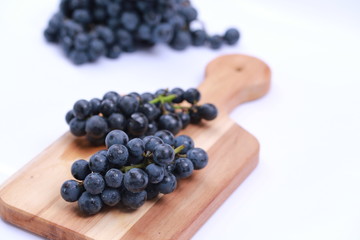 Concord Grapes on Wooden Block