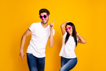 Photo of two people attend student party dancing and show sale advert wear cool specs and casual clothes isolated yellow color background