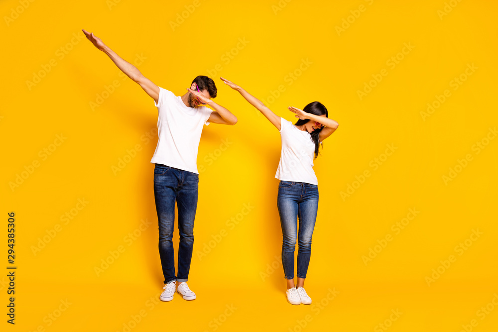 Wall mural Full body photo of two people dancing at theme party cool modern moves wear casual clothes isolated yellow color background