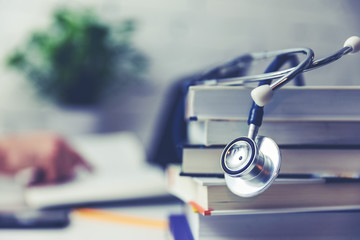 medical college student with stack of books