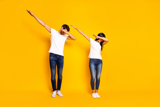 Full body photo of two people dancing at theme party cool modern moves wear casual clothes isolated yellow color background