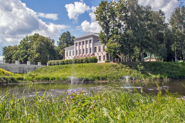 Fototapeta na wymiar Uglich Kremlin. View of the historic building of the city Council from the S-shaped brook Stone.