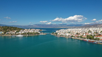 Aerial top view photo of famous old steel bridge of Halkida or Chalkida connecting mainland with Evia island, Greece