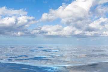 Obraz na płótnie Canvas blue sky with white clouds over the sea
