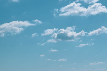 Naklejka na ściany i meble White clouds, on the blue sky, background