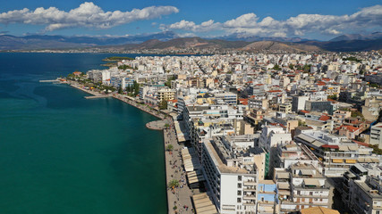 Fototapeta premium Aerial photo of famous seaside town of Halkida with beautiful clouds and deep blue sky, Evia island, Greece