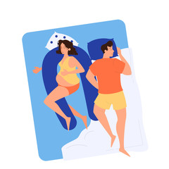 Fototapeta premium Pregnant woman and man sleeping in the bed