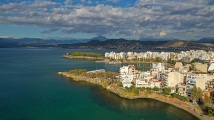 Fototapeta premium Aerial photo of famous seaside town of Halkida with beautiful clouds and deep blue sky, Evia island, Greece