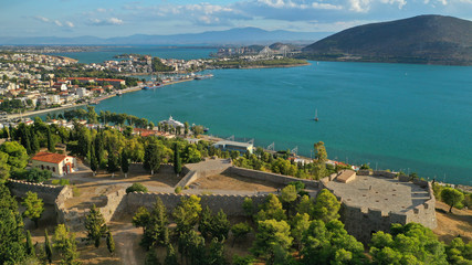 Naklejka premium Aerial drone photo of famous castle of Karampampa built on top of hill in seaside town of Halkida or Chalkida, Evia island, Greece