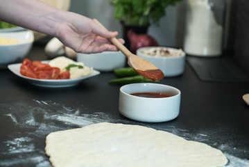 making homemade Italian-style pizza