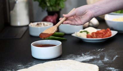 making homemade Italian-style pizza