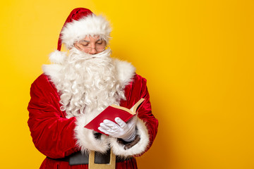 Santa Claus reading a book