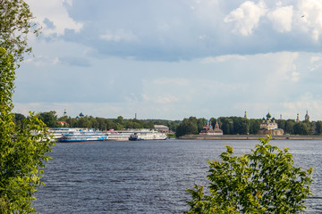 Fototapeta premium Uglich. Yaroslavl region. View of the Uglich Kremlin and the Volga river. The Church of St. Dimitry on the blood, Transfiguration Cathedral. Cruise ships berthed