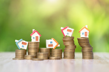 House on coins stack, Property investment and house mortgage financial. Risk management concept.