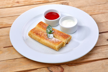 pancakes with sour cream and berry sauce