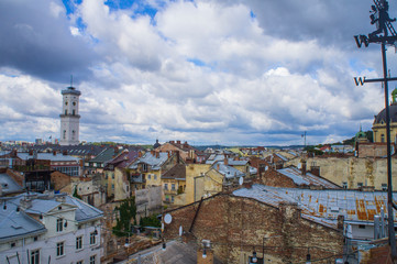 Urban old architecture. Red multi-colored roofs of European houses and buildings in the center.